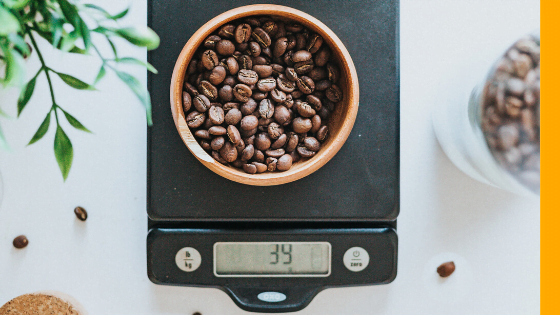 Coffee on a scale representing stress and weight gain