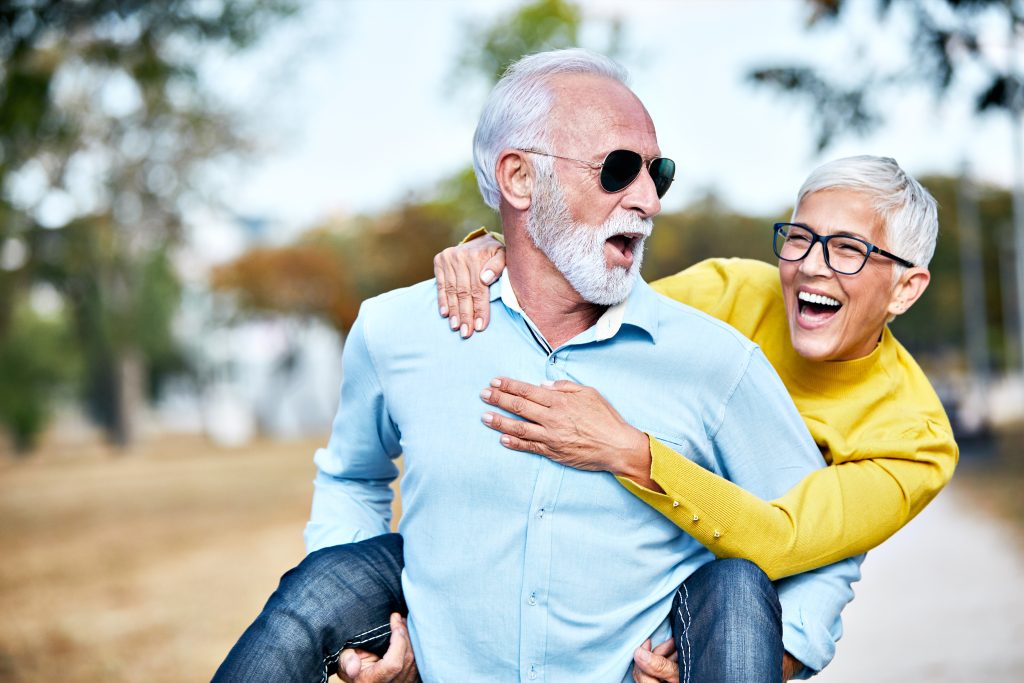 man and woman living a happy, fit, and long life